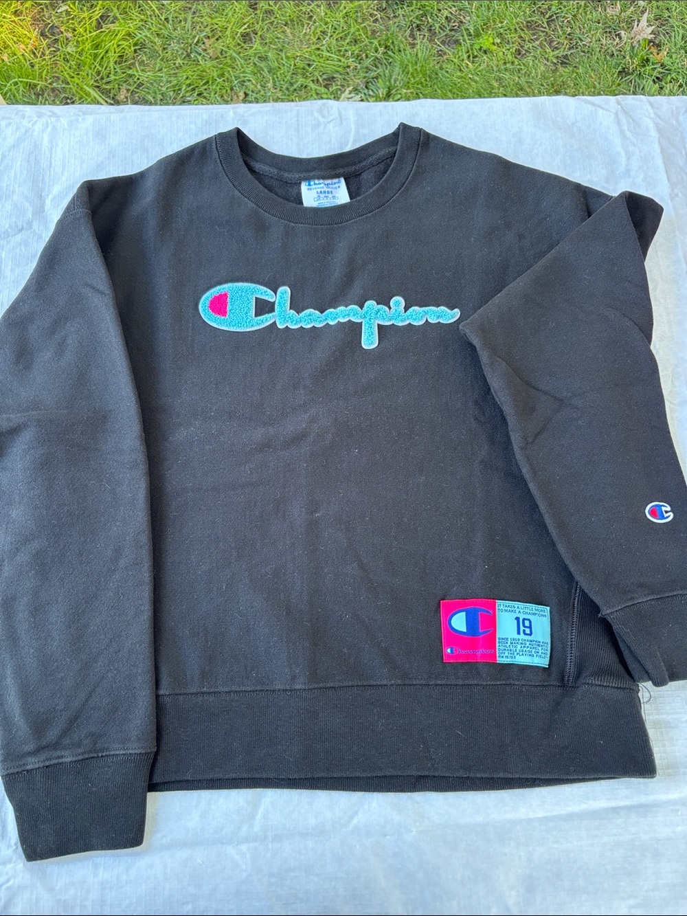 Champion Black Crewneck Sweatshirt with Aqua Script Logo